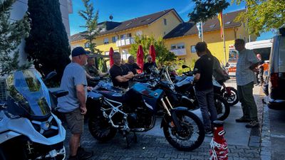 Adventure bikes packed and waiting in the hotel courtyard