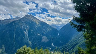 Steep forested valley and waterfall above Fusch, Austria