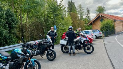 Three GS bikes parked at a village pull-off on the ride toward Austria