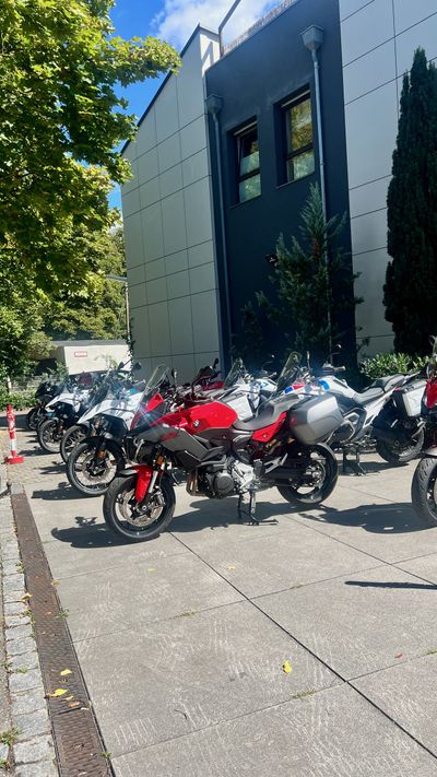 Tour bikes lined up on the patio at Hotel Schiller in Olching