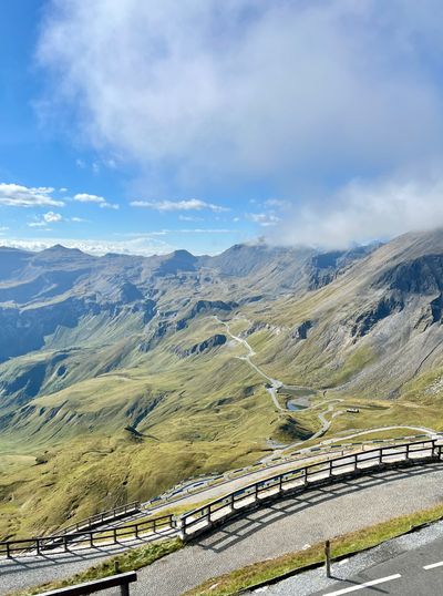 Looking down a winding Glockner road into a green valley