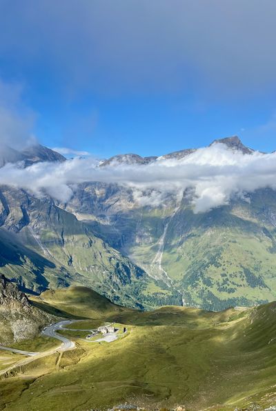 Looking down a cloud-filled valley from the Glockner