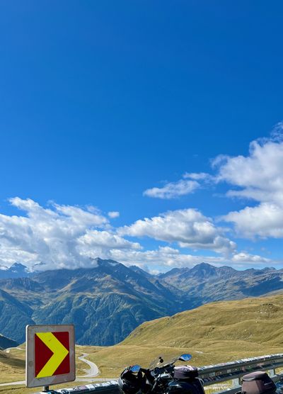 Two motorcycles at a wooden barrier overlook on the Glockner