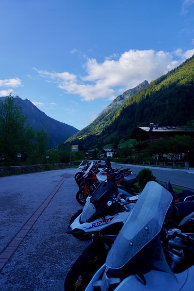 BMW GS bikes in early light in a Heiligenblut parking lot
