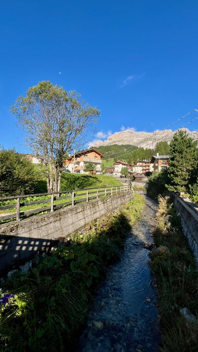 Chalets along the stream in Arabba