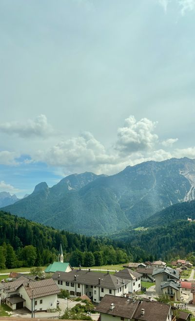 Village rooftops under a massif south of Arabba