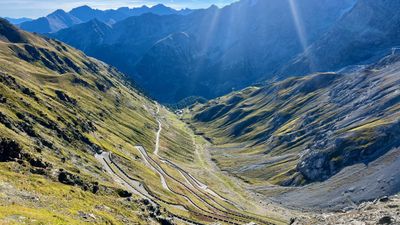 Wide view of the Stelvio hairpins after sunrise