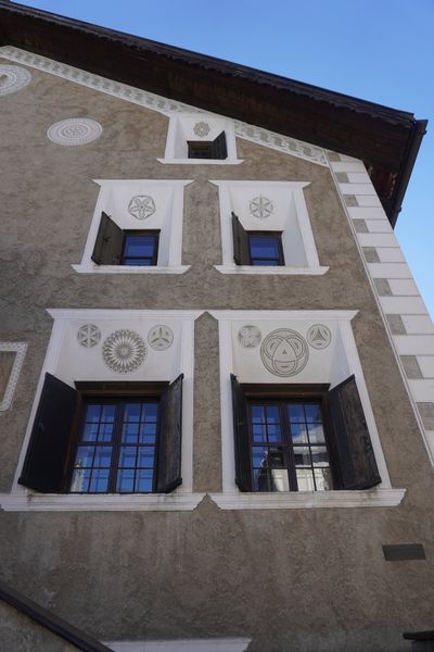 Windows with decorative sgraffito frames