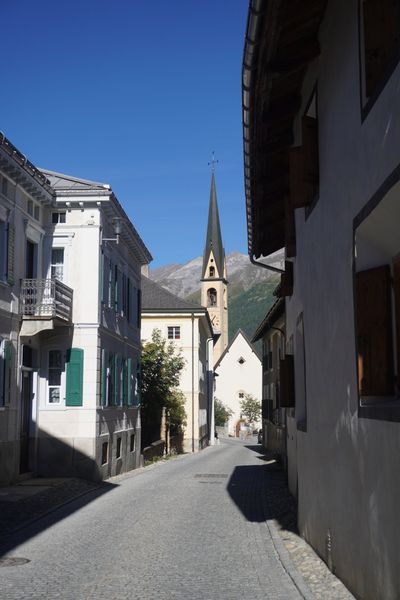 Village street pointing at the church steeple