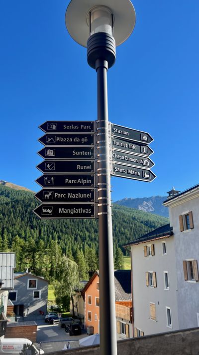 Wooden directional signpost in the village