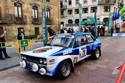 Spectators admiring the historic vehicles